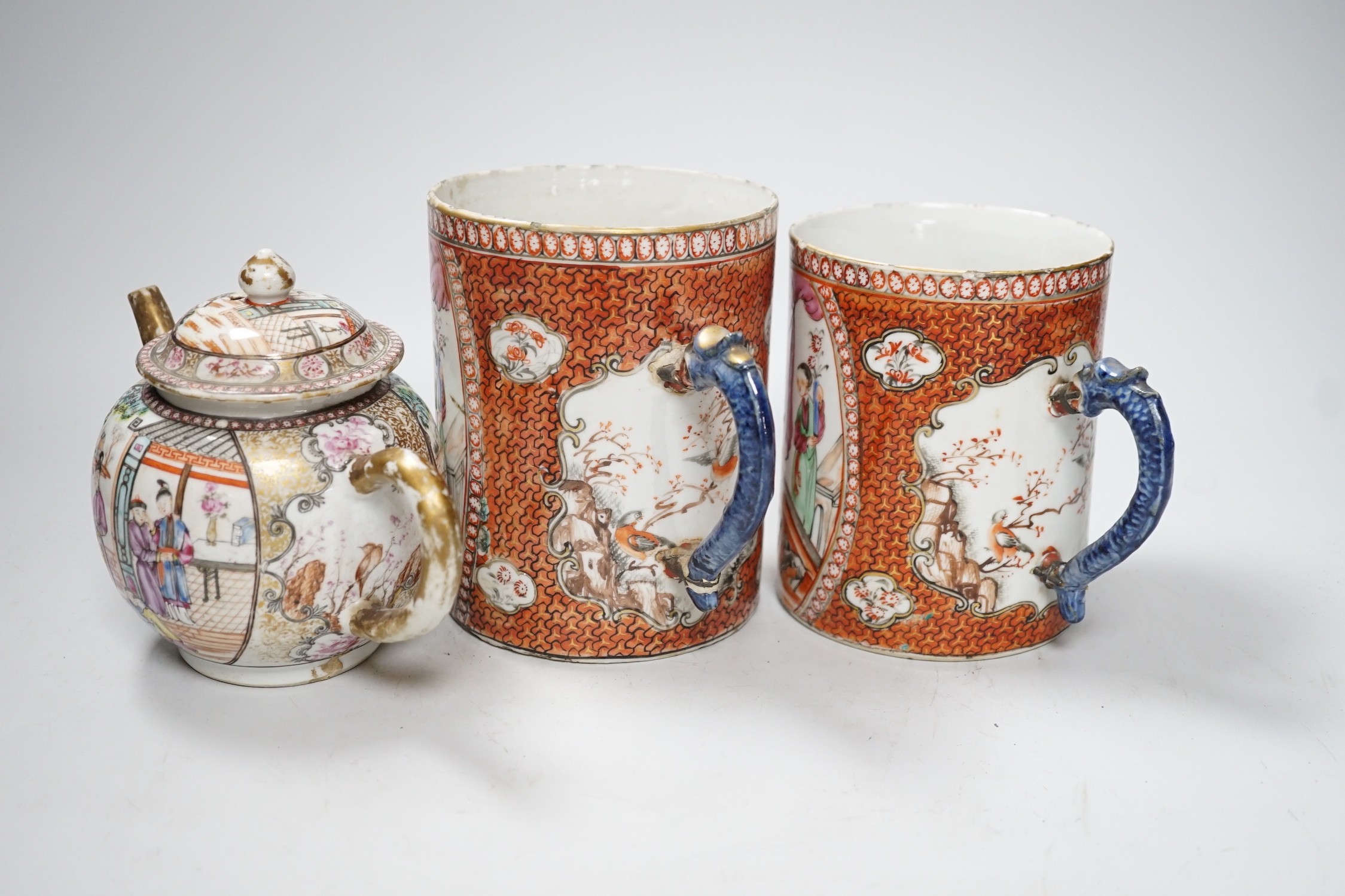 Two Chinese export 'mandarin' mugs and a similar teapot, Qianlong period, tallest mug 14cms high